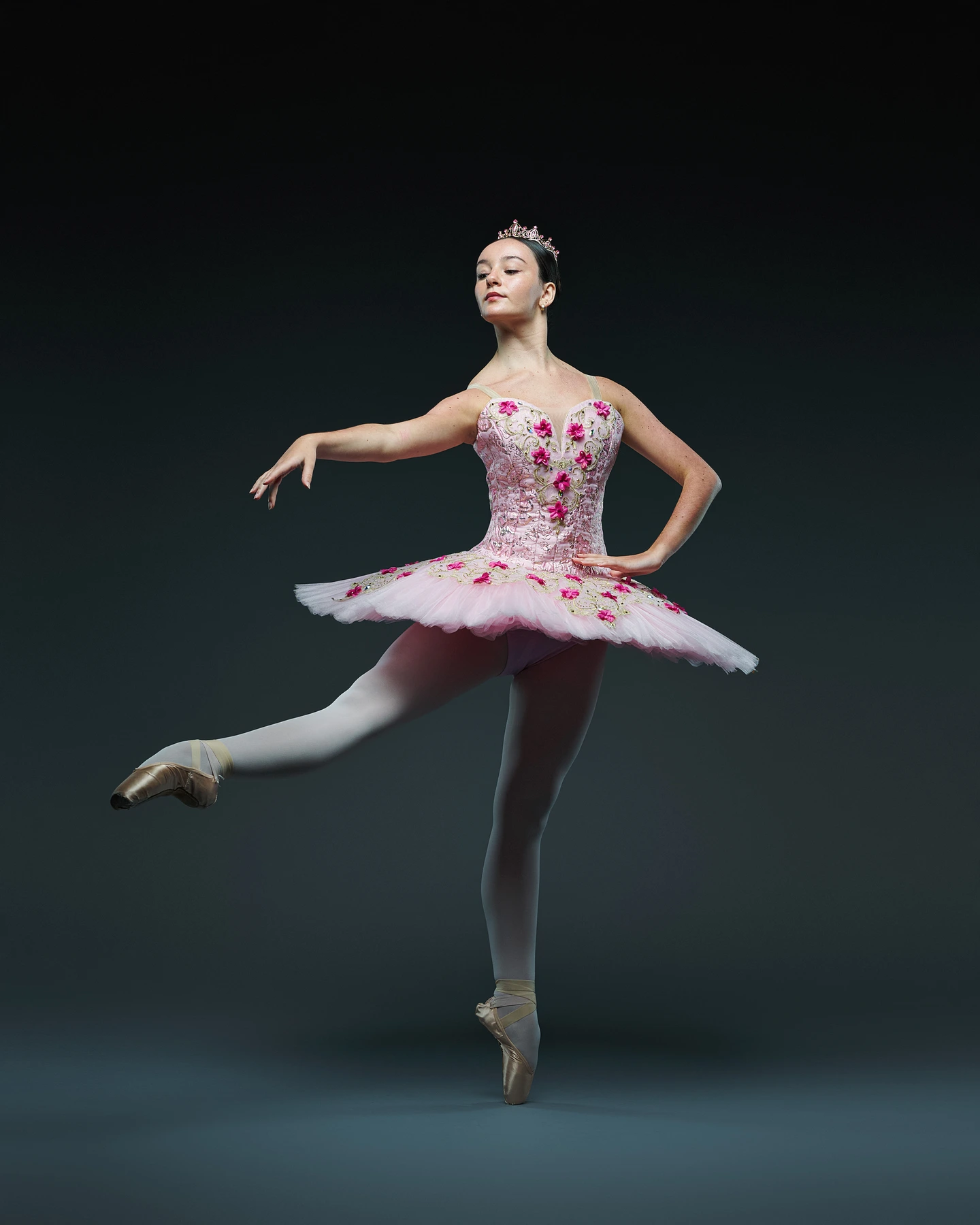 Ballet dancer in a pink floral tutu and tiara