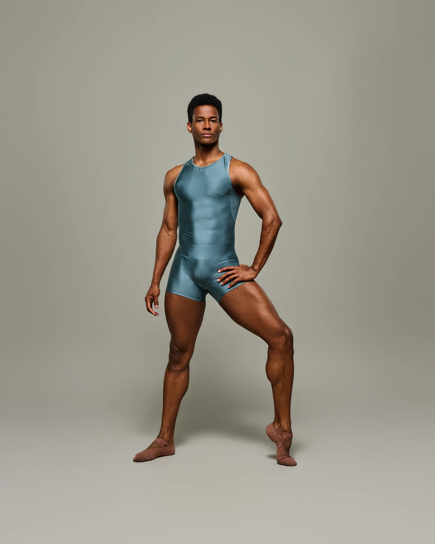 Male ballet dancer modeling a teal unitard